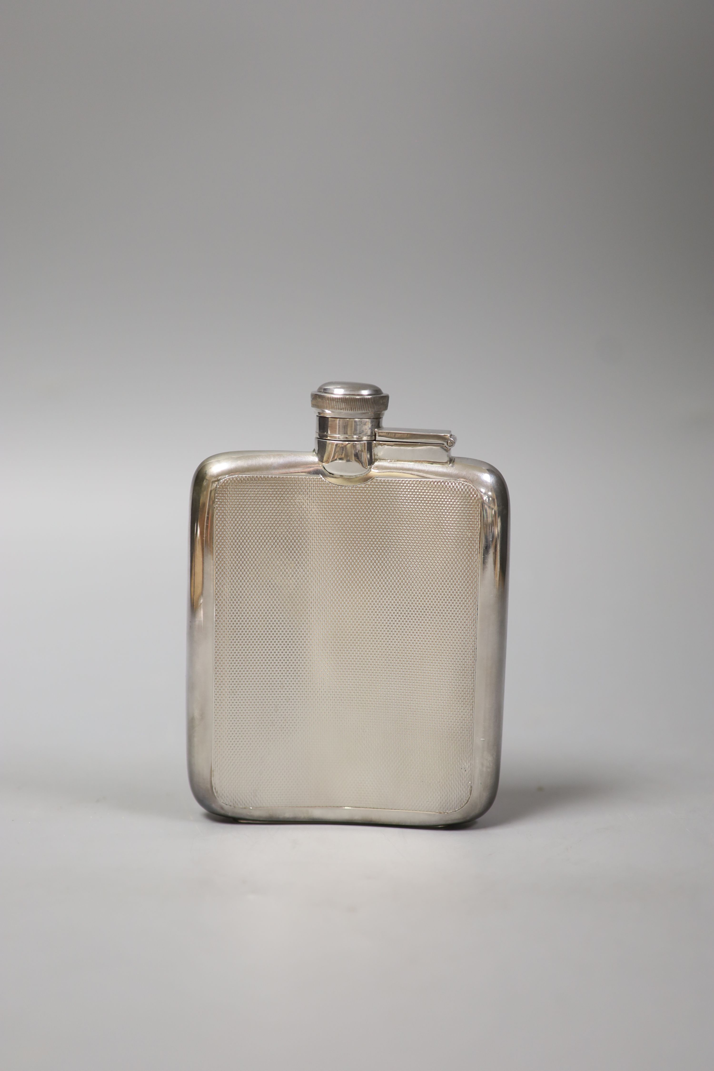 A James Dixon & Sons engine-turned silver hip flask, Sheffield, 1964,